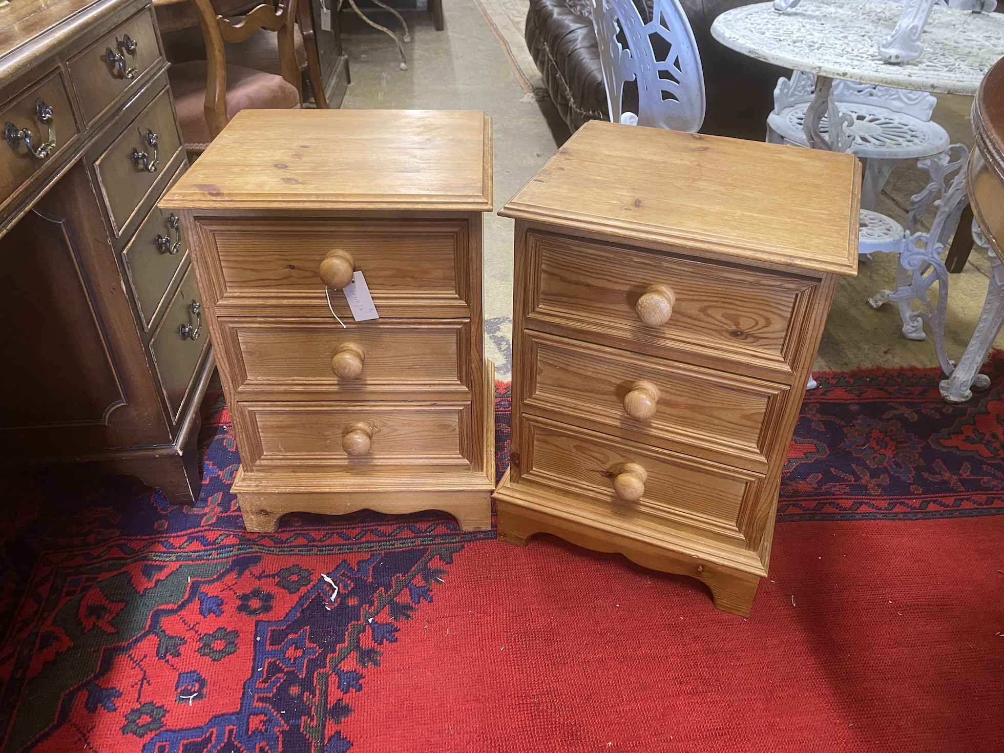 A pair of pine three drawer bedside chests, width 41cm, depth 36cm, height 59cm